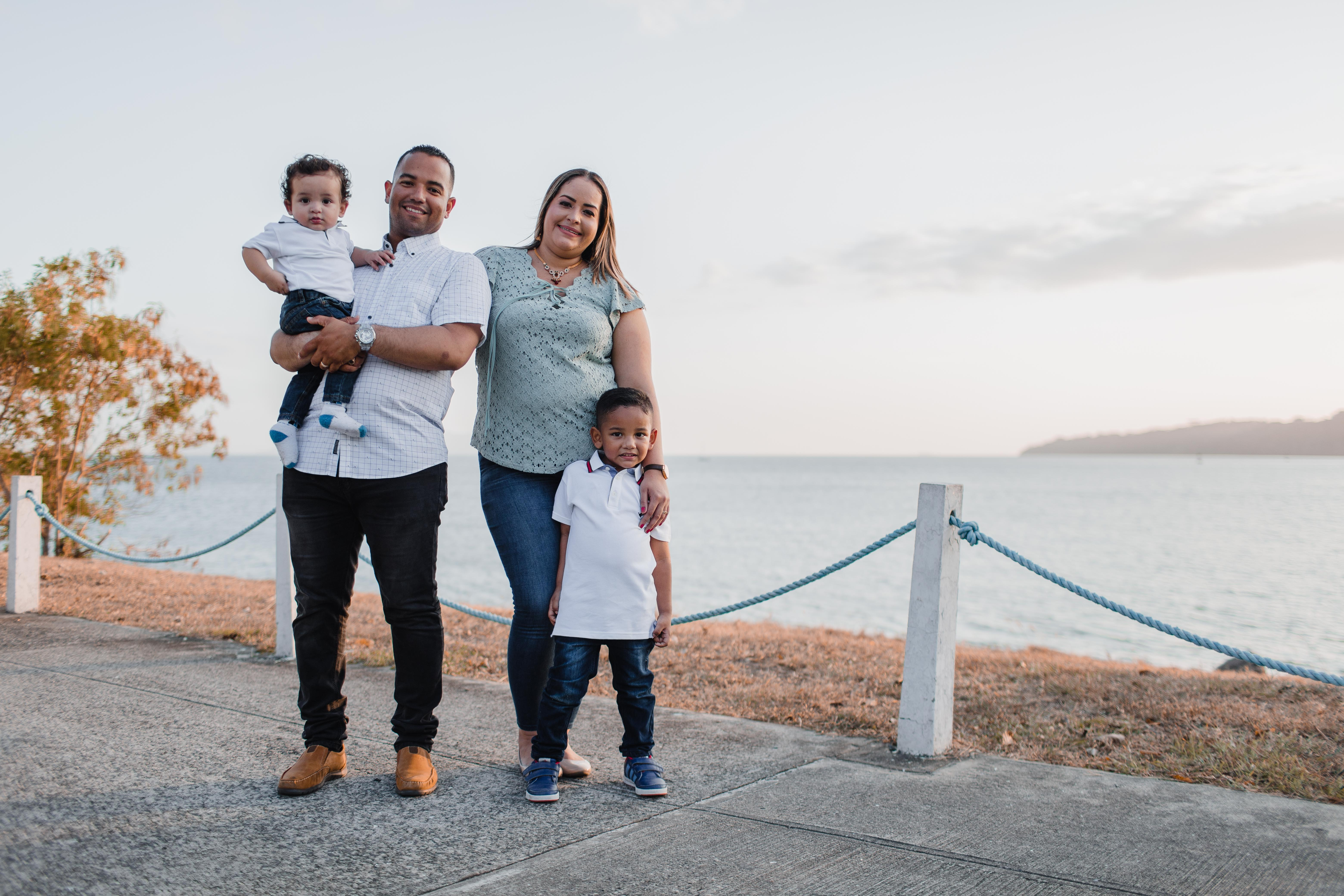 Canva - Man and Woman Standing Alongside With Their Children (1)